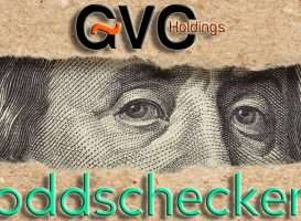 GVC en Oddschecker werken niet langer samen (bron: https://elements.envato.com/one-hundred-dollar-bill-behind-brown-craft-ripped--A8HBTDM)